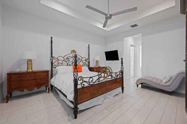 12582 Copper Mountain Pass, Boynton Beach, FL 33473 - bedroom featuring a tray ceiling, light wood-type flooring, and ceiling fan