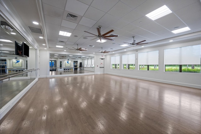 12582 Copper Mountain Pass, Boynton Beach, FL 33473 - unfurnished living room with wood finished floors, baseboards, a ceiling fan, and a drop ceiling