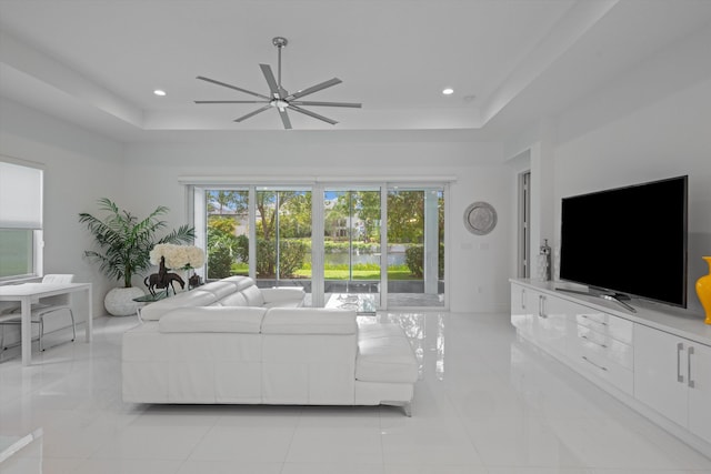 12582 Copper Mountain Pass, Boynton Beach, FL 33473 - living room with a raised ceiling, ceiling fan, light tile patterned floors, baseboards, and recessed lighting