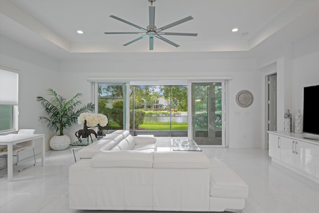 12582 Copper Mountain Pass, Boynton Beach, FL 33473 - living area with a ceiling fan, a tray ceiling, and recessed lighting