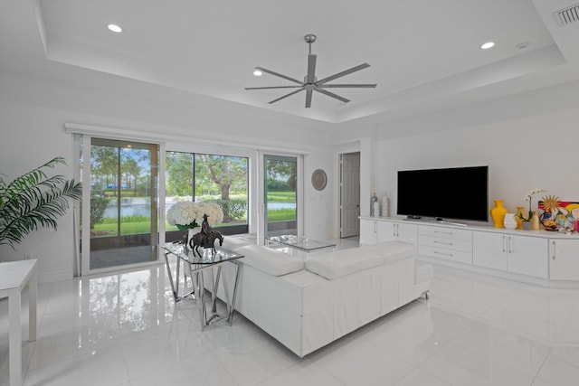 12582 Copper Mountain Pass, Boynton Beach, FL 33473 - living area featuring a raised ceiling, a ceiling fan, plenty of natural light, light tile patterned floors, and recessed lighting