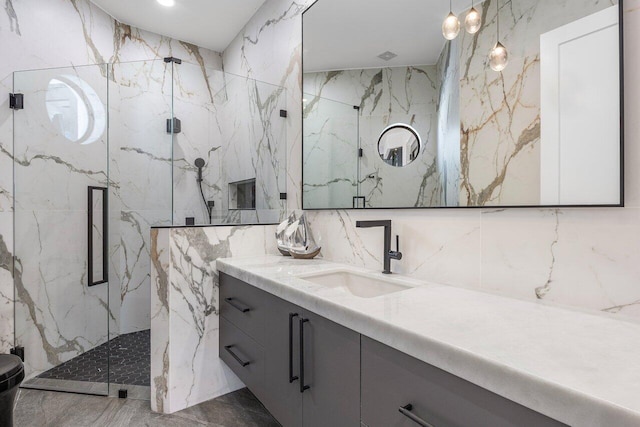 17709 Circle Pond Ct, Boca Raton, FL 33496 - full bath featuring tile walls, vanity, marble tiled flooring, a marble finish shower, and stone wall