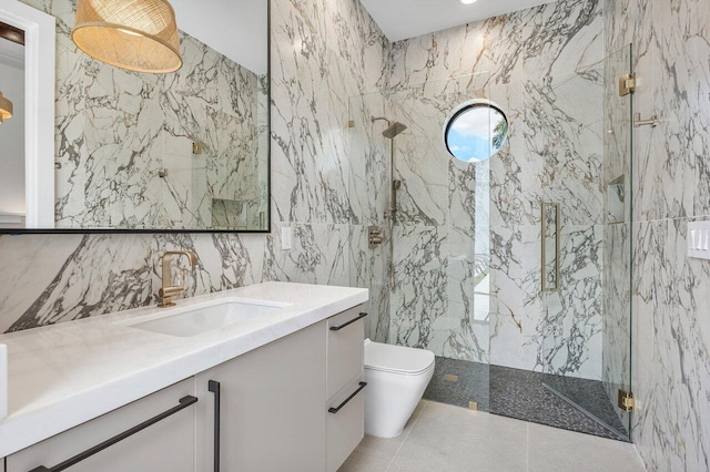 17709 Circle Pond Ct, Boca Raton, FL 33496 - bathroom featuring tile walls, toilet, a marble finish shower, and vanity