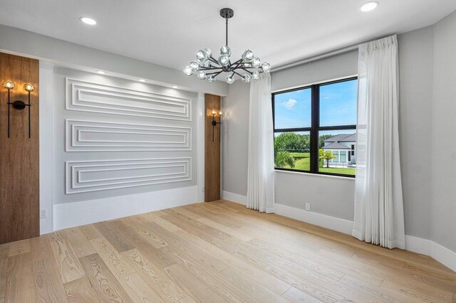 17709 Circle Pond Ct, Boca Raton, FL 33496 - unfurnished room featuring a chandelier, wood finished floors, baseboards, and recessed lighting