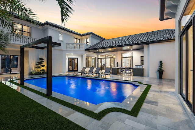 17709 Circle Pond Ct, Boca Raton, FL 33496 - pool at dusk featuring an outdoor pool and a patio area