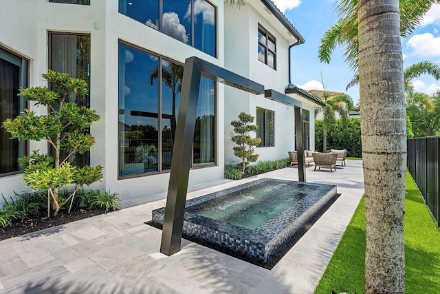 17709 Circle Pond Ct, Boca Raton, FL 33496 - rear view of house featuring stucco siding and a patio