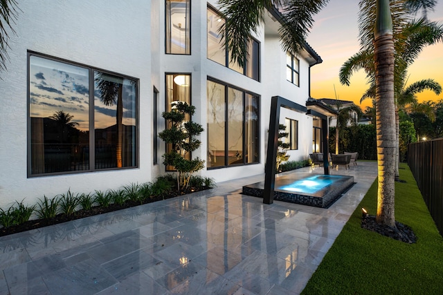 17709 Circle Pond Ct, Boca Raton, FL 33496 - rear view of house featuring stucco siding and a patio