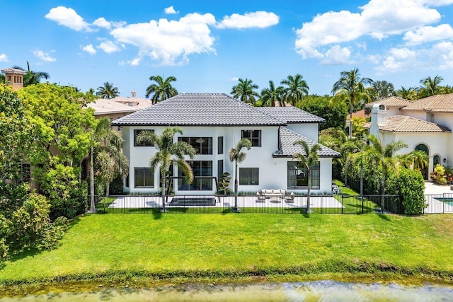 17709 Circle Pond Ct, Boca Raton, FL 33496 - back of property featuring a tile roof, stucco siding, a patio area, and a chimney