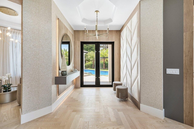 17709 Circle Pond Ct, Boca Raton, FL 33496 - entrance foyer with a raised ceiling, a chandelier, and french doors