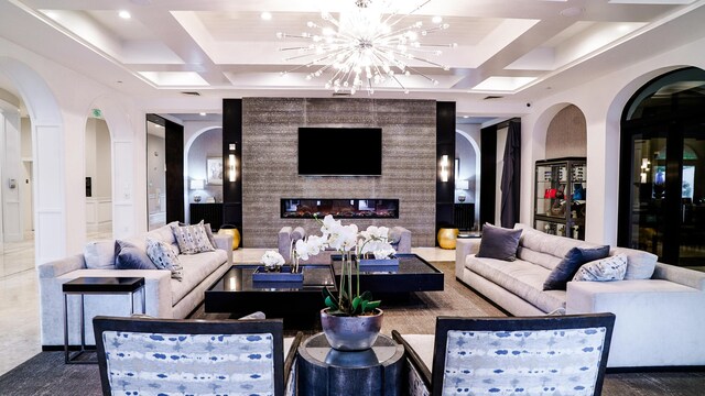 17709 Circle Pond Ct, Boca Raton, FL 33496 - living area featuring coffered ceiling, arched walkways, a chandelier, recessed lighting, and beamed ceiling