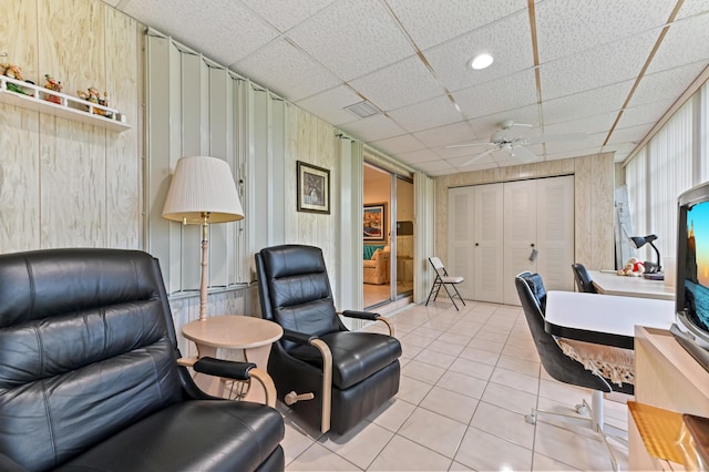 109 Lake Rebecca Dr Unit 109, West Palm Beach, FL 33411 - office area with light tile patterned flooring, a drop ceiling, ceiling fan, and wood walls