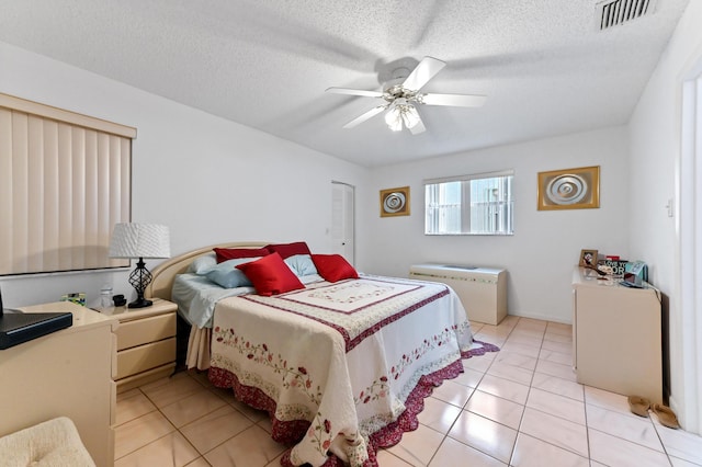 109 Lake Rebecca Dr Unit 109, West Palm Beach, FL 33411 - bedroom with light tile patterned flooring, ceiling fan, and a textured ceiling