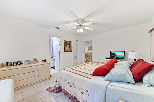 109 Lake Rebecca Dr Unit 109, West Palm Beach, FL 33411 - bedroom featuring light tile patterned flooring, ensuite bathroom, and ceiling fan