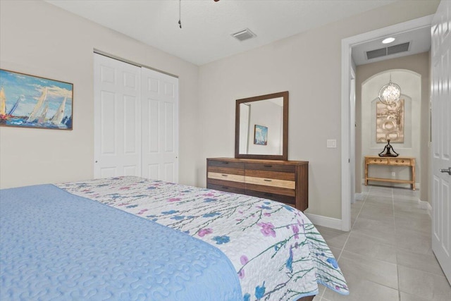 8369 Paladin Sq, Vero Beach, FL 32967 - bedroom with light tile patterned floors, a closet, baseboards, and a ceiling fan