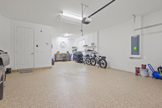 8369 Paladin Sq, Vero Beach, FL 32967 - garage featuring electric panel and a garage door opener