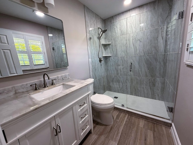1807 Crafton Rd, North Palm Beach, FL 33408 - bathroom with a shower stall, toilet, vanity, and wood finished floors