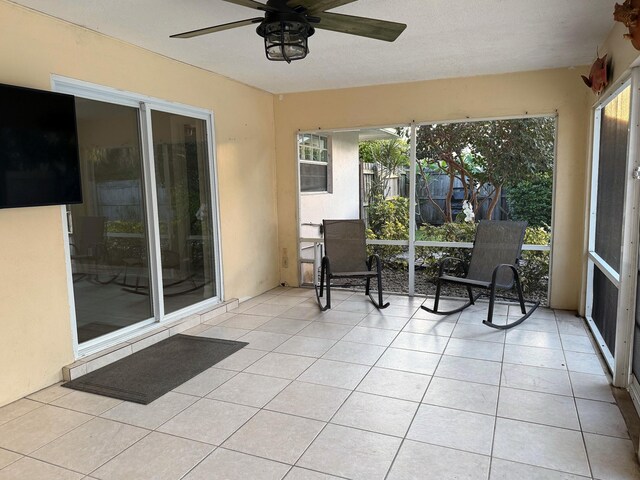 1807 Crafton Rd, North Palm Beach, FL 33408 - sunroom / solarium with a ceiling fan and tile patterned floors