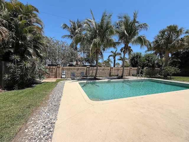 1807 Crafton Rd, North Palm Beach, FL 33408 - swimming pool featuring a patio area and fence