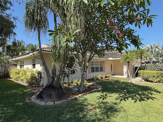 1807 Crafton Rd, North Palm Beach, FL 33408 - view of front of home featuring stucco siding and a tiled roof