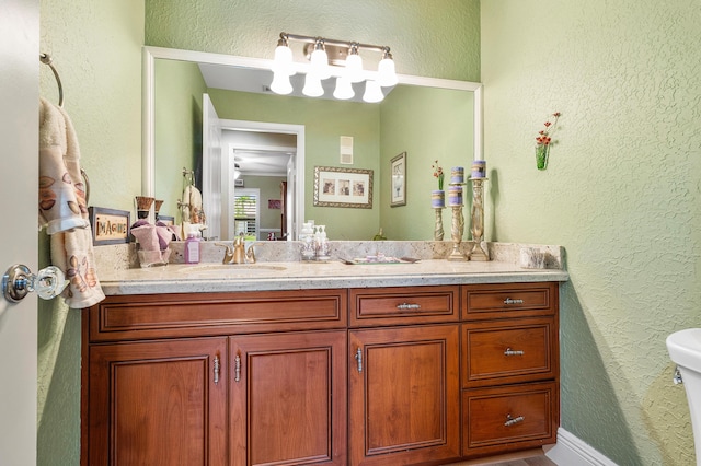 11700 Island Lakes Ln, Boca Raton, FL 33498 - bathroom with a textured wall, vanity, and toilet