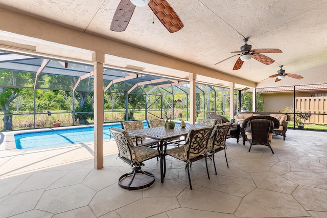 11700 Island Lakes Ln, Boca Raton, FL 33498 - sunroom with a pool, ceiling fan, and outdoor dining space