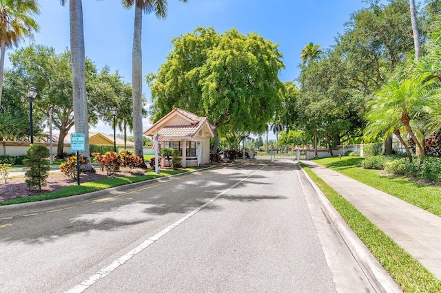 11700 Island Lakes Ln, Boca Raton, FL 33498 - view of asphalt street featuring street lights and curbs