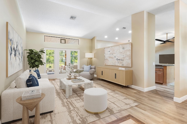 11700 Island Lakes Ln, Boca Raton, FL 33498 - living area featuring vaulted ceiling, light wood finished floors, baseboards, a ceiling fan, and french doors