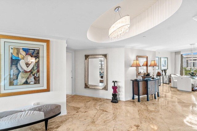 3740 S Ocean Blvd Unit 403, Highland Beach, FL 33487 - hall with baseboards, a chandelier, and crown molding