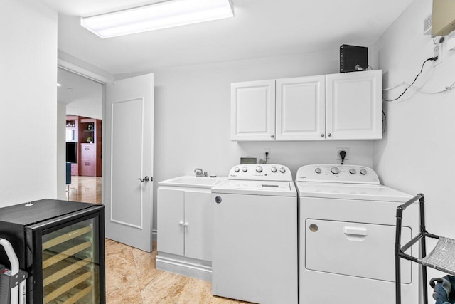 3740 S Ocean Blvd Unit 403, Highland Beach, FL 33487 - washroom with wine cooler, cabinet space, and washer and clothes dryer