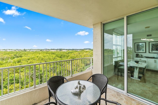 3740 S Ocean Blvd Unit 403, Highland Beach, FL 33487 - balcony featuring a view of trees and outdoor dining area