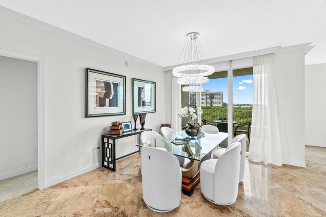 3740 S Ocean Blvd Unit 403, Highland Beach, FL 33487 - dining room with ornamental molding, a chandelier, and baseboards