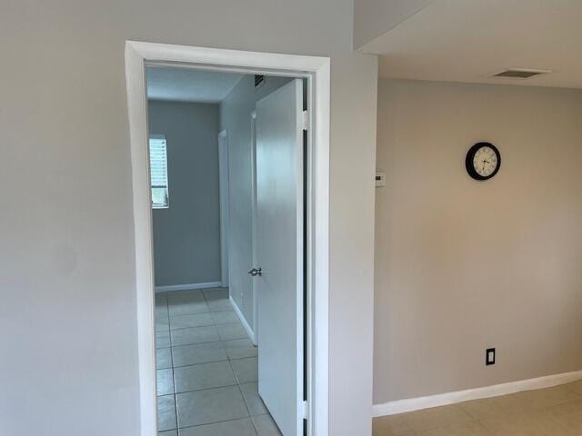 111 SE 1st St Unit 7, Boynton Beach, FL 33435 - corridor featuring light tile patterned floors and baseboards