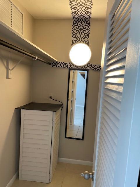 111 SE 1st St Unit 7, Boynton Beach, FL 33435 - walk in closet with light tile patterned floors