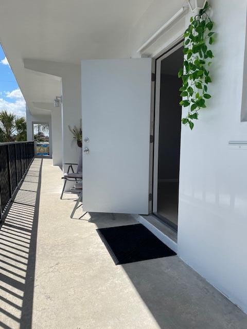 111 SE 1st St Unit 7, Boynton Beach, FL 33435 - entrance to property with a balcony