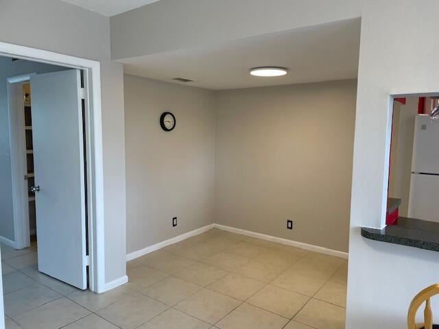 111 SE 1st St Unit 7, Boynton Beach, FL 33435 - unfurnished room with light tile patterned floors and baseboards