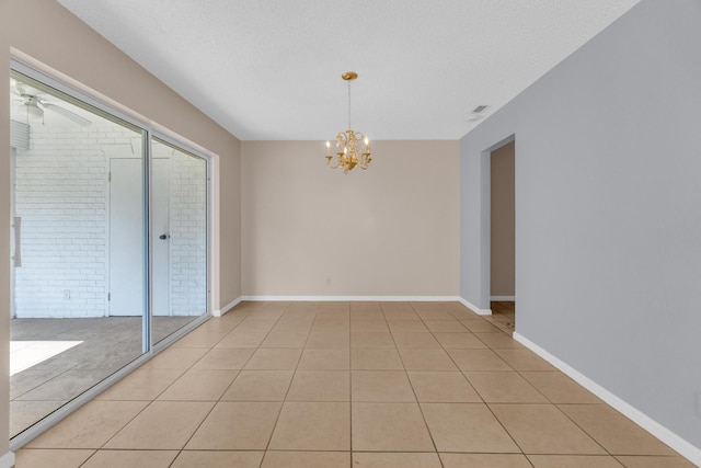 10109 45th Trl S, Boynton Beach, FL 33436 - empty room featuring a chandelier, a ceiling fan, light tile patterned flooring, baseboards, and a textured ceiling