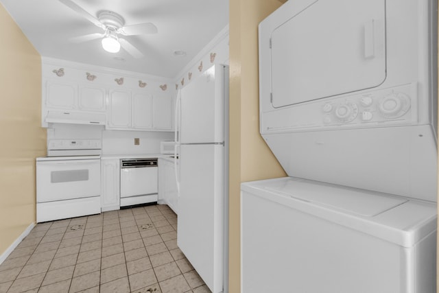 10109 45th Trl S, Boynton Beach, FL 33436 - kitchen featuring estacked washer and dryer, white appliances, under cabinet range hood, white cabinetry, and light countertops