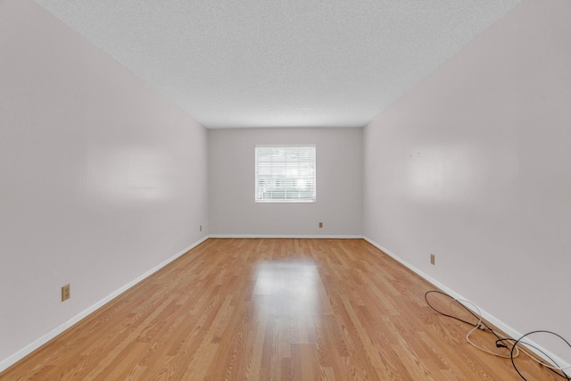 10109 45th Trl S, Boynton Beach, FL 33436 - spare room with light wood finished floors, baseboards, and a textured ceiling