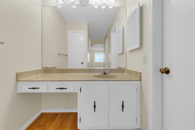 10109 45th Trl S, Boynton Beach, FL 33436 - bathroom featuring wood finished floors, vanity, and baseboards