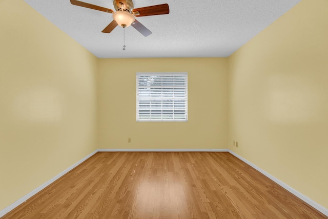 10109 45th Trl S, Boynton Beach, FL 33436 - empty room featuring light wood finished floors, baseboards, a ceiling fan, and a textured ceiling