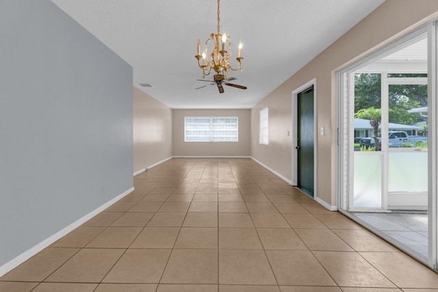 10109 45th Trl S, Boynton Beach, FL 33436 - unfurnished room with a chandelier, light tile patterned floors, baseboards, and ceiling fan