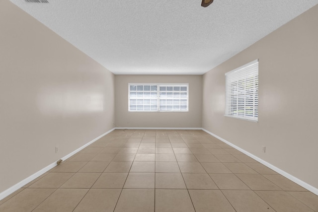 10109 45th Trl S, Boynton Beach, FL 33436 - spare room with a textured ceiling, light tile patterned floors, and baseboards