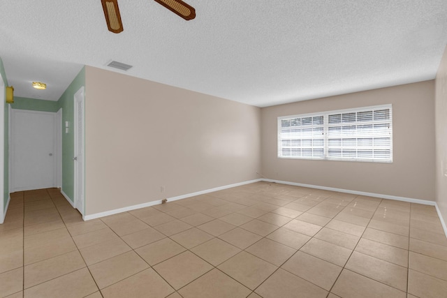 10109 45th Trl S, Boynton Beach, FL 33436 - unfurnished room with a textured ceiling, light tile patterned flooring, a ceiling fan, and baseboards