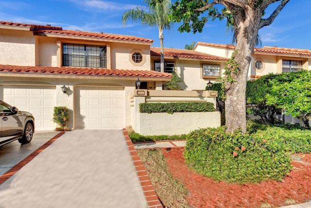 7844 La Mirada Dr, Boca Raton, FL 33433 - mediterranean / spanish-style home featuring driveway, stucco siding, a garage, and a tiled roof