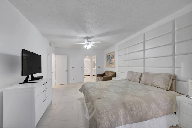 7844 La Mirada Dr, Boca Raton, FL 33433 - bedroom with light marble finish floors, a textured ceiling, ceiling fan, and connected bathroom