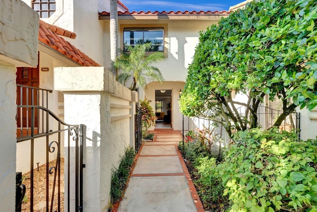 7844 La Mirada Dr, Boca Raton, FL 33433 - property entrance with a tile roof and stucco siding