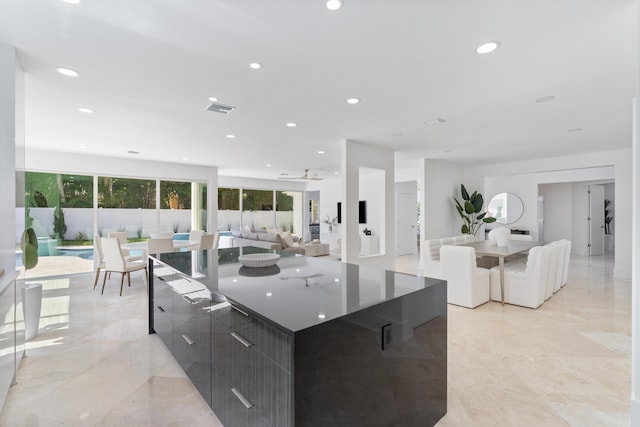 2646 NW 49th St, Boca Raton, FL 33434 - kitchen featuring modern cabinets, a spacious island, recessed lighting, open floor plan, and dark countertops