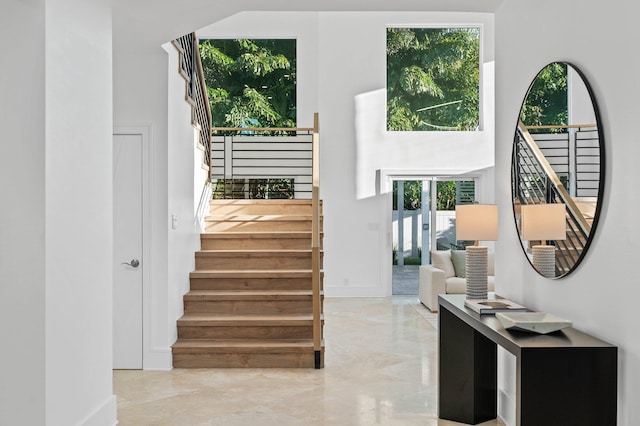 2646 NW 49th St, Boca Raton, FL 33434 - staircase with baseboards and marble tiled flooring