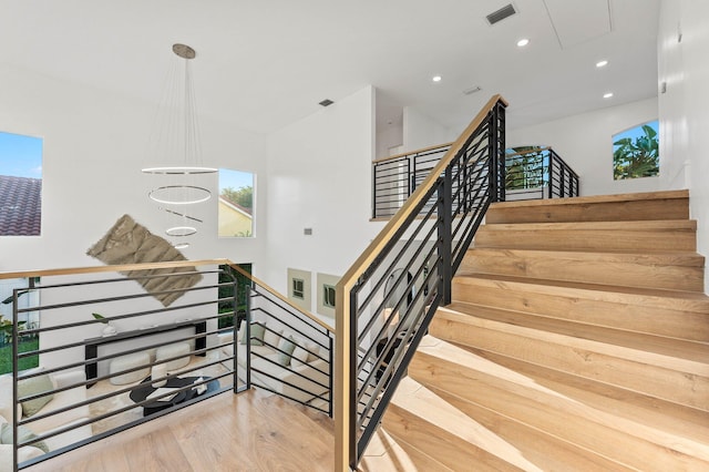 2646 NW 49th St, Boca Raton, FL 33434 - staircase with attic access, wood finished floors, and recessed lighting