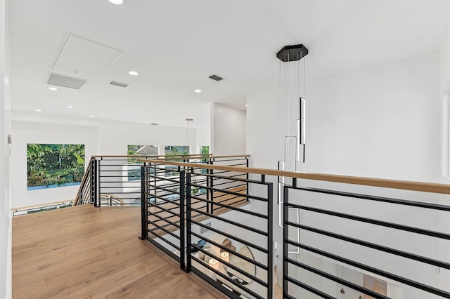 2646 NW 49th St, Boca Raton, FL 33434 - hallway featuring an upstairs landing, light wood-style floors, recessed lighting, attic access, and a baseboard radiator